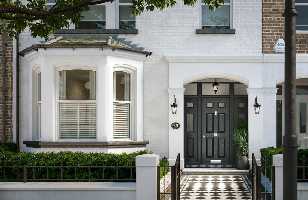 Elegant home frontage with a black entrance door and bay windows